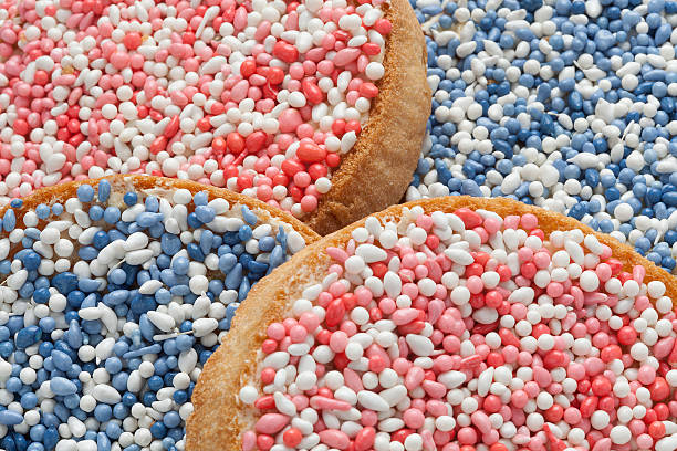Beschuit met muisjes, a traditional dutch treat 'Beschuit met muisjes, a traditional treat to celebrate the birth of a child in The Netherlands. Pink sprinkles for a girl, blue for a boy zwieback toast stock pictures, royalty-free photos & images
