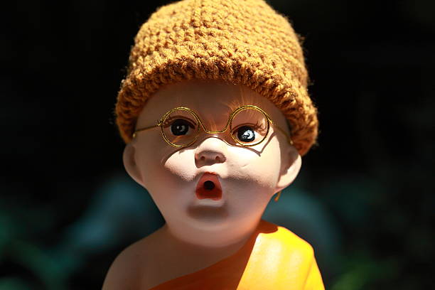 istock Little Monk Porcelain doll 490861100