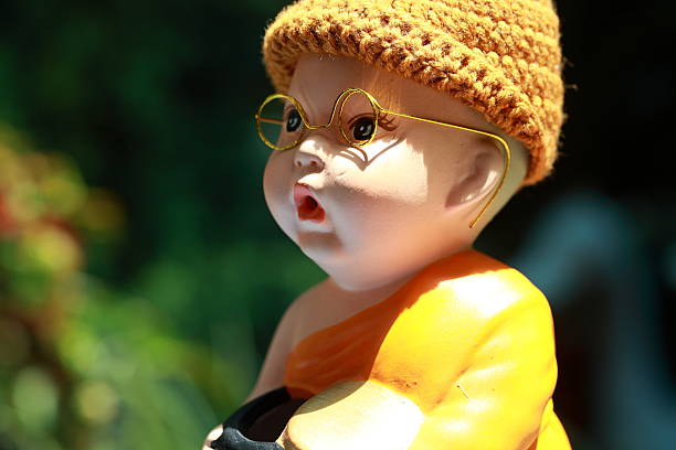 istock Little Monk Porcelain doll 490876000
