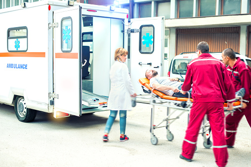 Medical emergency team helping injured man