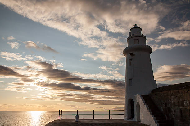 istock Lighthouse and sunset on the sea 490880314