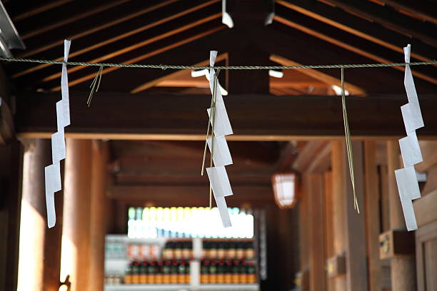 SHIDE-zigzag-shaped paper streamer Taken at a Shrine in Tokyo. shrine photos stock pictures, royalty-free photos & images