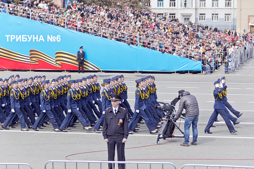 Samara, Russia - May 9, 2015: Russian woman midshipmans march at the parade on annual Victory Day