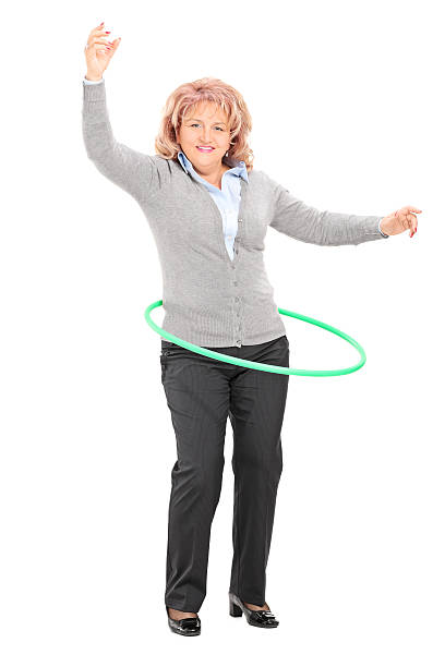 istock Mature woman spinning a hula hoop 490881189