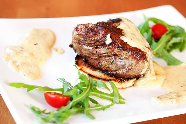 Veal tenderloin with gorgonzola sauce, rucola and cherry tomatoes