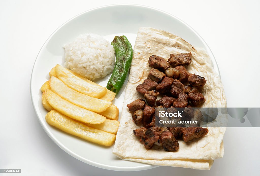 turkish sıs kebab turkish şiş kebab with fried potatoes , rice, green papper and lavash 2015 Stock Photo