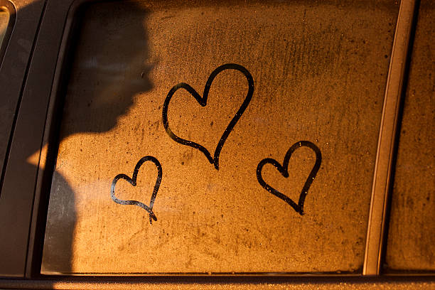istock Hearts draw on water of window 490882109