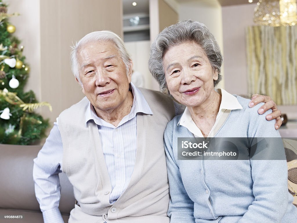 senior couple home portrait of senior asian couple smiling. Senior Adult Stock Photo