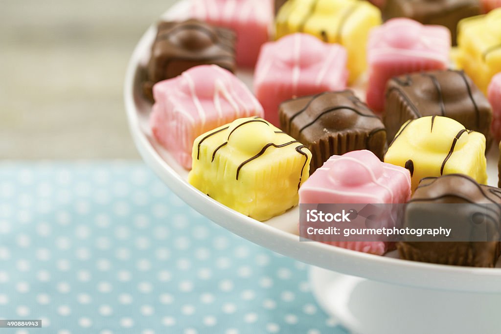 French Fondant Fancies, a type of Petit Four A series on French Fondant Fancies, a type of Petit Four Brown Stock Photo