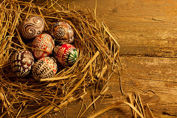 istock Easter eggs in nest on wooden table 490885173