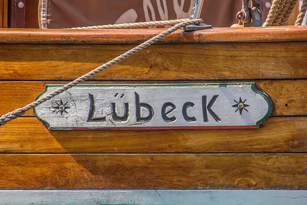 Wooden sign om a boat in the port of Lubeck, Germany