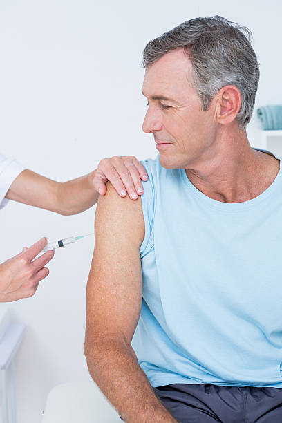 istock Doctor doing an injection to her patient 490886442