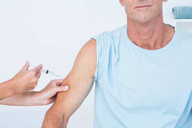 istock Doctor doing an injection to her patient 490886572