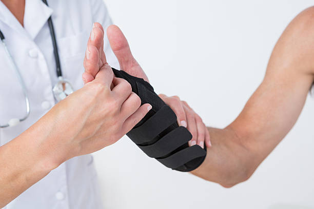 istock Doctor examining a man wrist 490886918