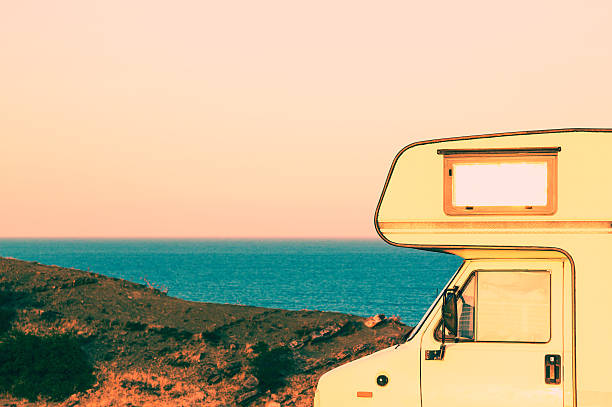 istock Part of camper on the seashore at sunset 490887296