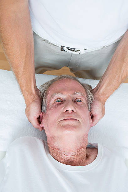 istock Man receiving neck massage 490890168