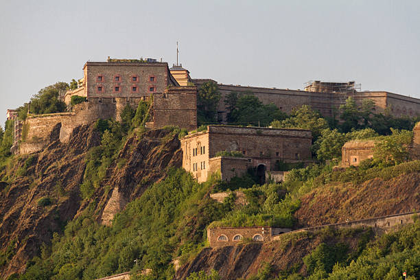 Koblenz, Germany - July 17,  2015: Afternoon shot of the Ehrenbreitstein fortress taken during a boat trip along the Rhine. The current construction was built by Prussia between 1817 and 1828.