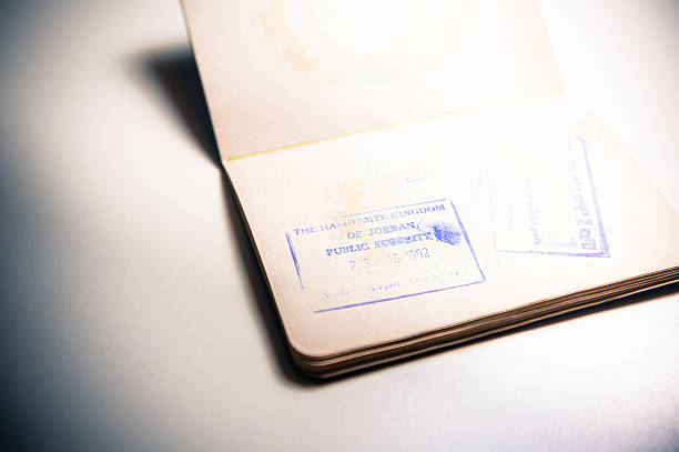 istock Jordan border stamp on old european passport 490891404