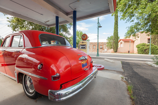 Cottonwood, Arizona USA - August 29, 2015, An old red Plymouth at the gas pump reminds of times gone by.