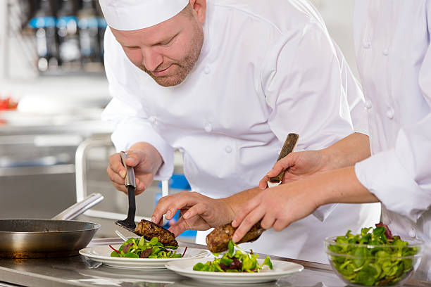 istock Professional chef prepare steak dish at restaurant 490911394