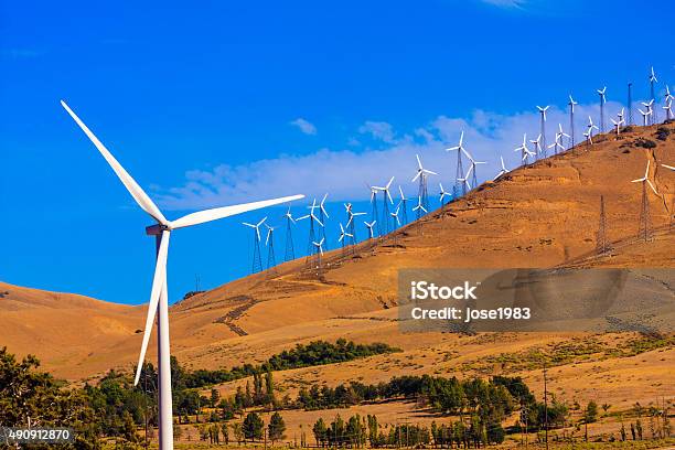 Windfarm On A Bright Sunny Day Stock Photo - Download Image Now - 2015, Blue, Business Finance and Industry