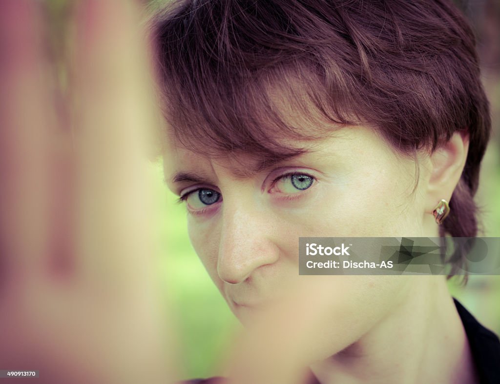 Woman in depression A woman in a very depressed mood covers his face 2015 Stock Photo