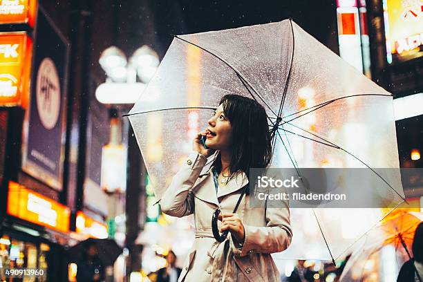 Japanese Woman Outside In The Rain Stock Photo - Download Image Now - 20-24 Years, 2015, Adult