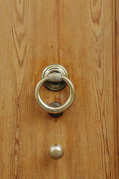 istock Wooden door with old bronze handle and knob 490915796