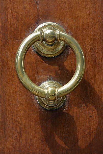 istock Dark wooden door with old bronze handle 490916132