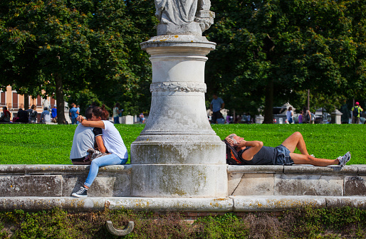 Padova, Italy - August 24, 2014: View of lovers under the statue in Prato della Valle on August 24, 2014