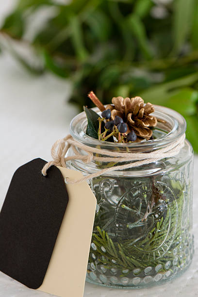 istock Christmas decorations in glass bottle with tags 490917240