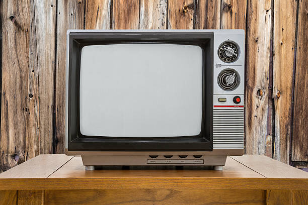 istock Vintage Portable Television and table with Rustic Cabin Wall 490919656