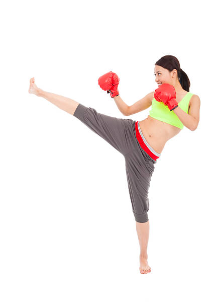 istock pretty sporty woman is kicking 490924521
