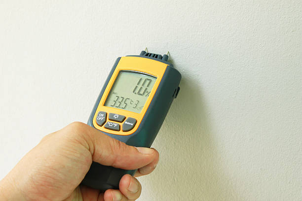 moisture meter metering moisture in wall painting wet stock pictures, royalty-free photos & images