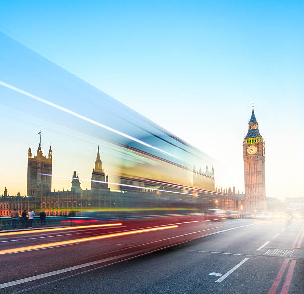 istock London sunset - Big Ben with blurred double-decker bus 490929791