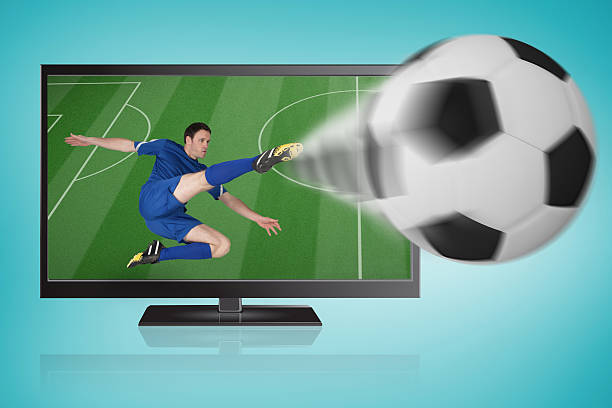 football player in blue kicking ball out of tv - fußball heute im fernsehen 個照片及圖片檔