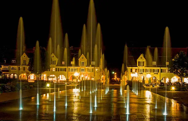 many illuminated fountains in the dark on the market square in Freudenstadt