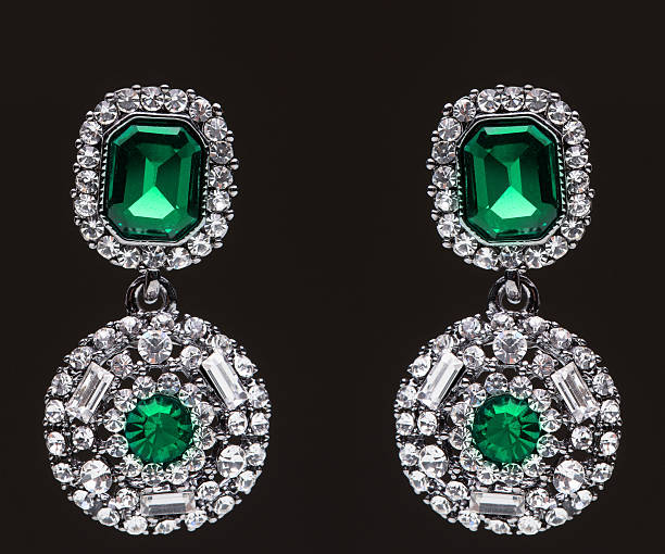 istock earrings with green stones on the black 490938436