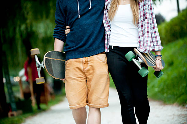 istock Couple with Longboard in the park 490939812