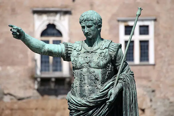 Statue S.P.Q.R. IMP CAESAR Augustus PATRIAE PATER on street Via dei Fori Imperiali, Rome, Italy