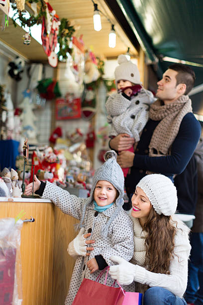 istock parents with kids at  X-mas market 490944678