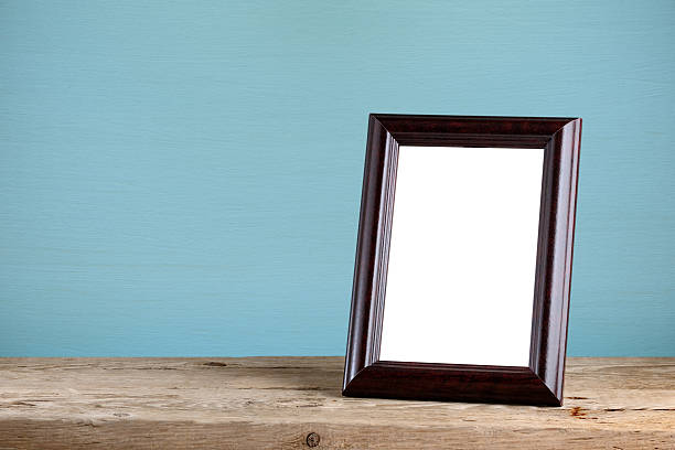 Photo frame on old wooden table Photo frame on old wooden table table photos stock pictures, royalty-free photos & images