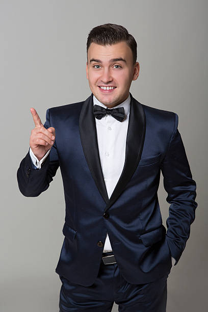 istock Stylish man in a suit with  butterfly tie standing on 490959676