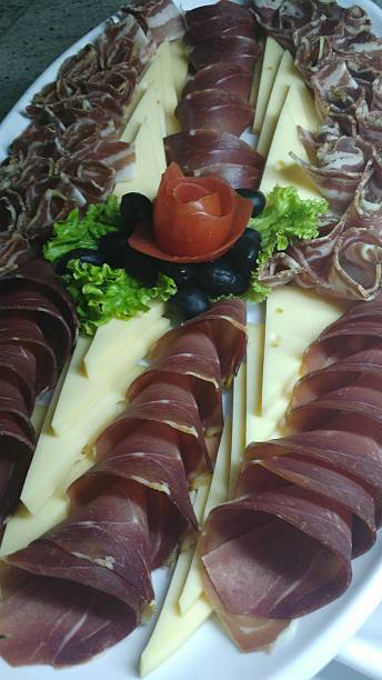 istock Prosciutto and cheese plate with decoration 490959942