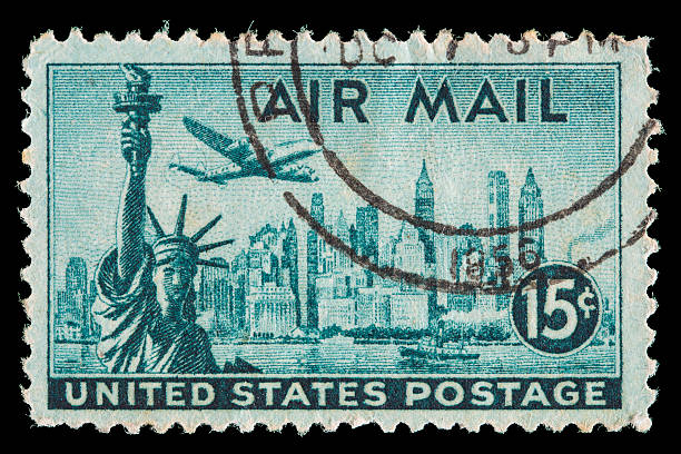 istock USA air mail postage stamp with airplane, New York Skyline 490960498