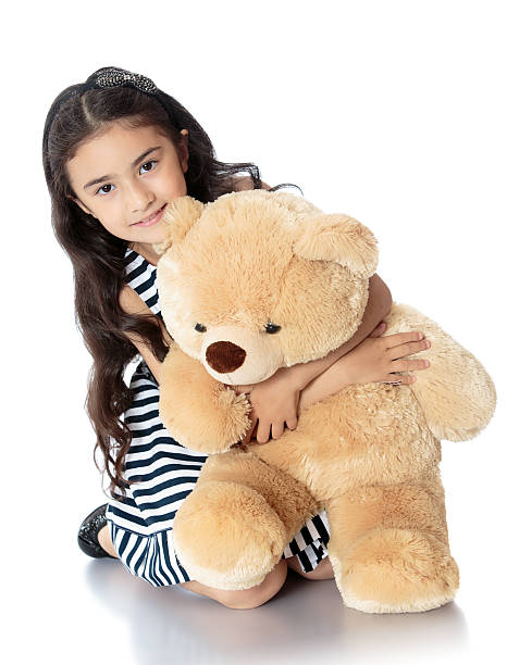 istock girl with teddy bear 490963042