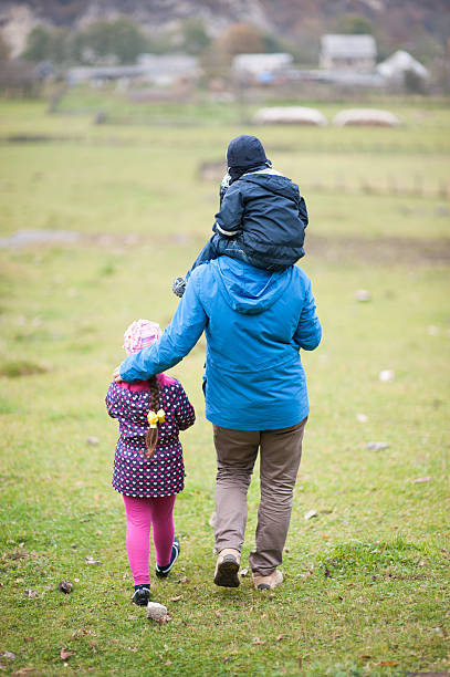 istock father with children down to the village 490964296