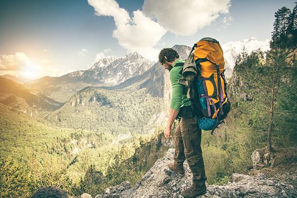 istock Young Man Traveler with backpack relaxing outdoor 490966326