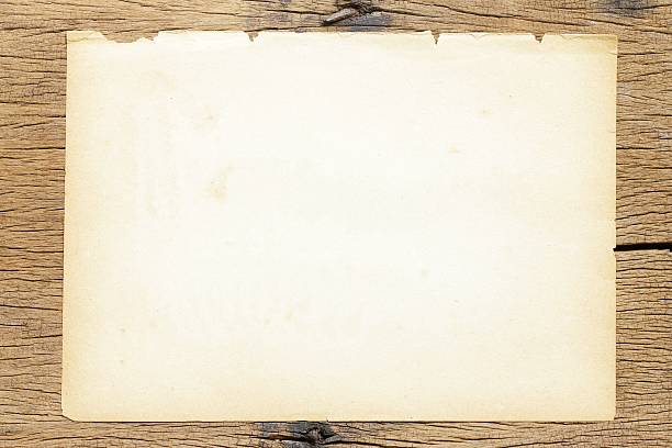 istock Brown paper sheets  on wooden table 490967036