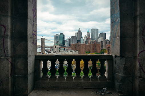New York City downtown architecture skyline through abandoned balcony.